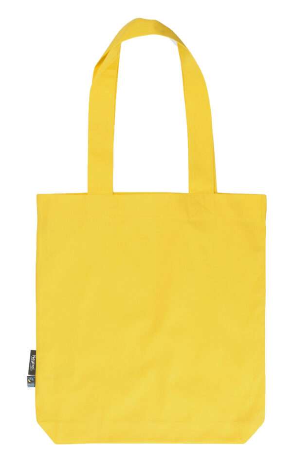 Gelbe Stofftasche mit langen Henkeln und kleinem Fairtrade-Etikett